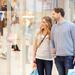 Couple looking in a store window in a shopping mall Thumbnail