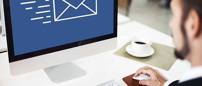 Man at Computer receiving an email