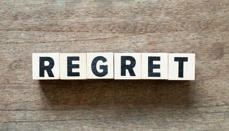 tiles-spelling-regret-on-a-table