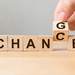 Small wooden blocks displaying the word Chance is changing to Change Thumbnail