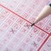 Lottery slip being filled out by pencil Thumbnail