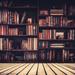 Landscape shot of old, thick books in a wooden bookshelf Thumbnail