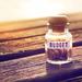 Glass jar on a wooden table, filled with coins and labelled "budget" Thumbnail