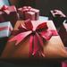 Seven neatly wrapped presents laid on a table Thumbnail