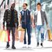 Three fashionable men holding multiple shopping bags on a shopping spree Thumbnail